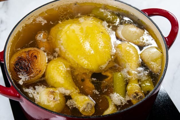 Fully simmered chicken stock with golden broth.