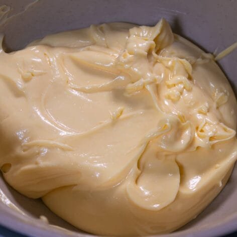 Creamy homemade mayonnaise in a mixing bowl.