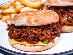Sloppy Joes with melted cheese, pickles, and toasted buns.