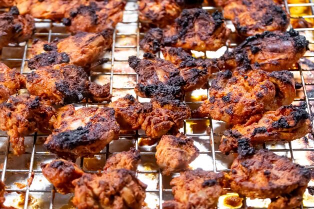 Oven-baked marinated chicken pieces with a charred, tandoori-style crust, ready to be added to Butter Chicken sauce.