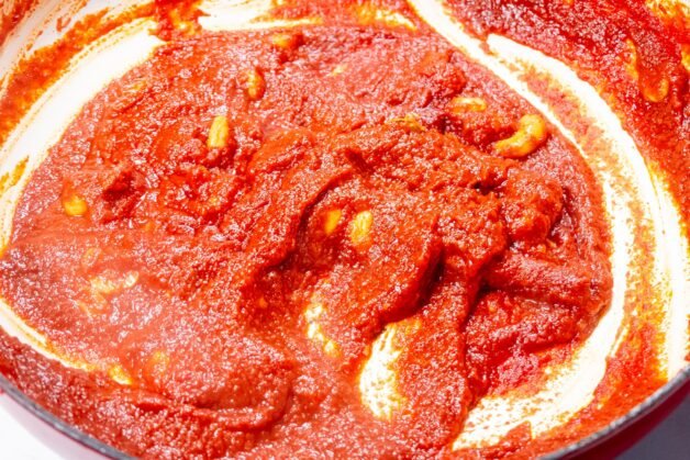 Rich tomato sauce simmering with cashews, spices, and aromatics, creating the creamy base for Butter Chicken.
